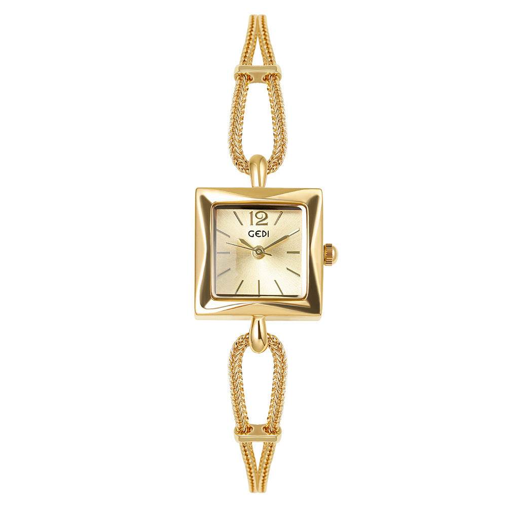 Gold wristwatch with a square face on a white background