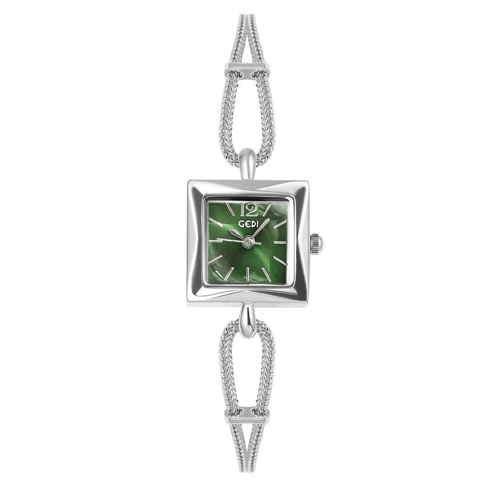 Silver watch with a green face on a white background