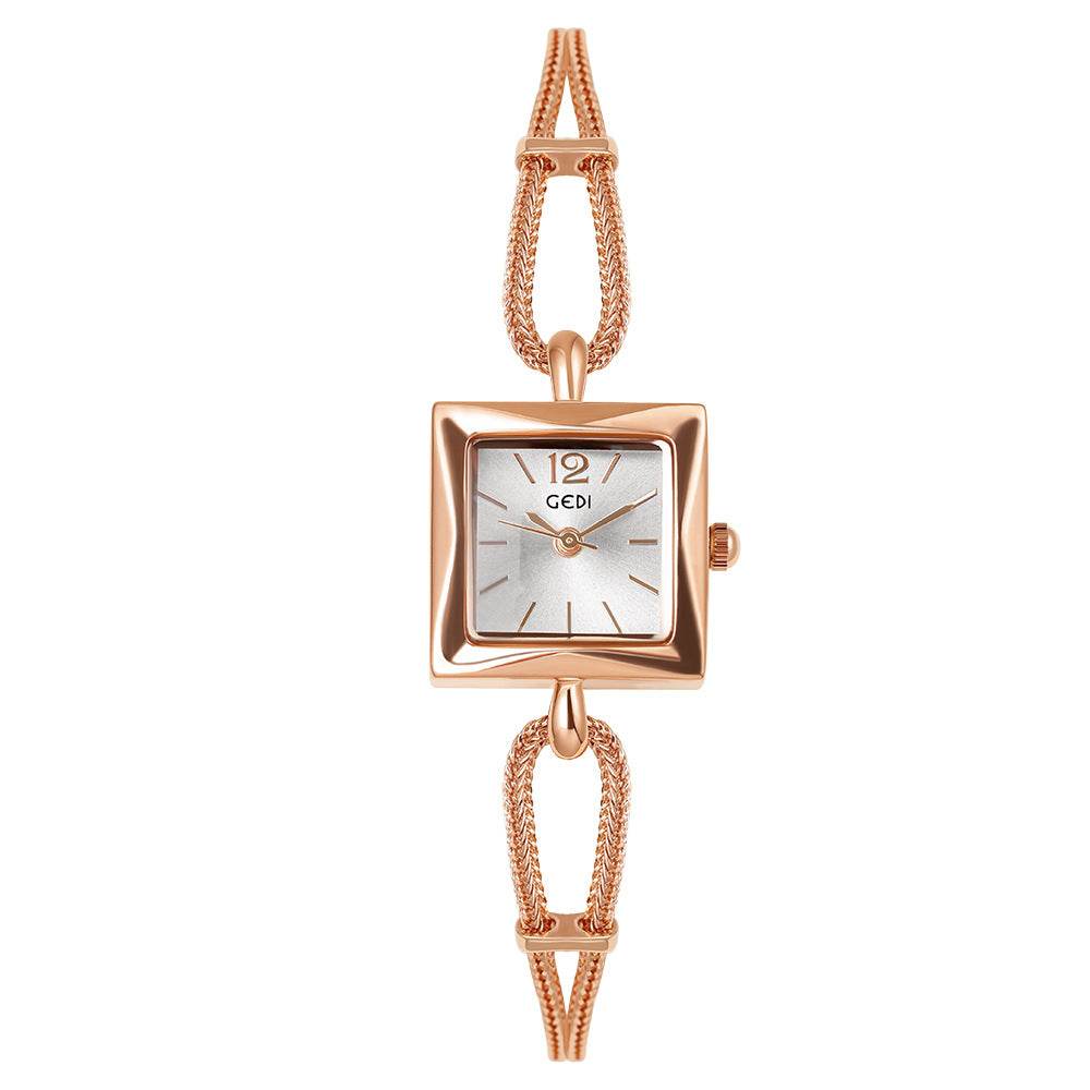 Rose gold watch with a square face on a white background